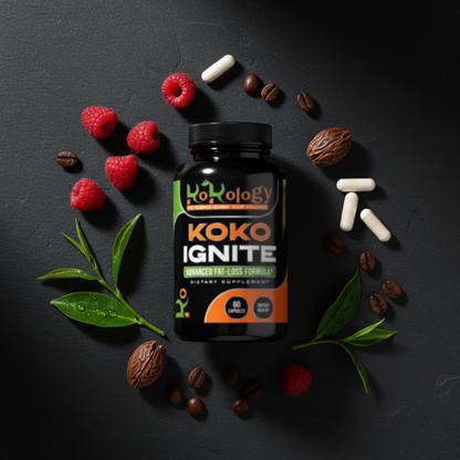 Koko Ignite flat lay with raspberries, kola nuts, green tea leaves and coffee beans on dark slate