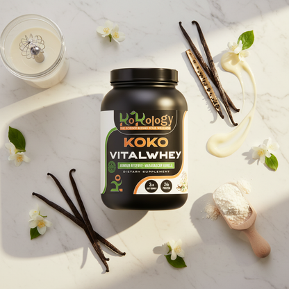 Koko VitalWhey Armour Reserve Madagascar Vanilla flat lay with protein container, split vanilla pods, cream drizzle and glass shaker on marble