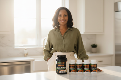 Radiant Black woman in bright modern kitchen with all 7 Kokology Thrive Bundle products naturally displayed on counter beside her
