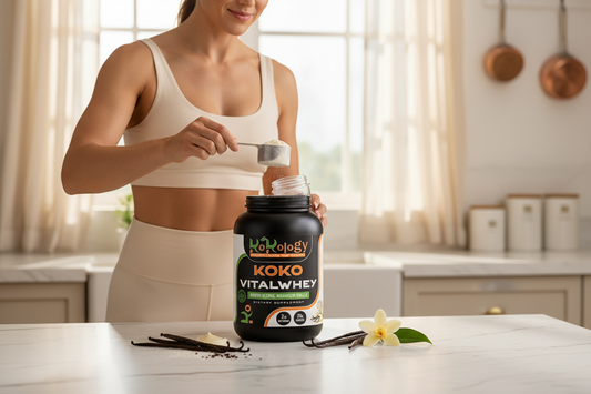 Koko VitalWhey Armour Reserve Madagascar Vanilla - woman scooping protein with split vanilla bean pods and white flowers on marble