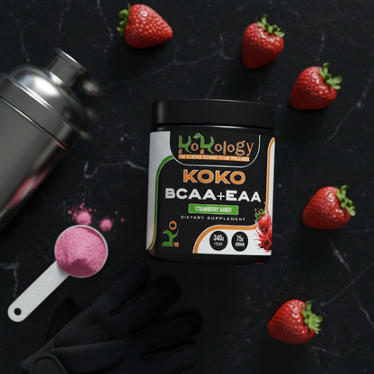 Koko BCAA+EAA Strawberry Kandy dark flat lay with tub as hero, softly blurred strawberries, shaker and gym accessories